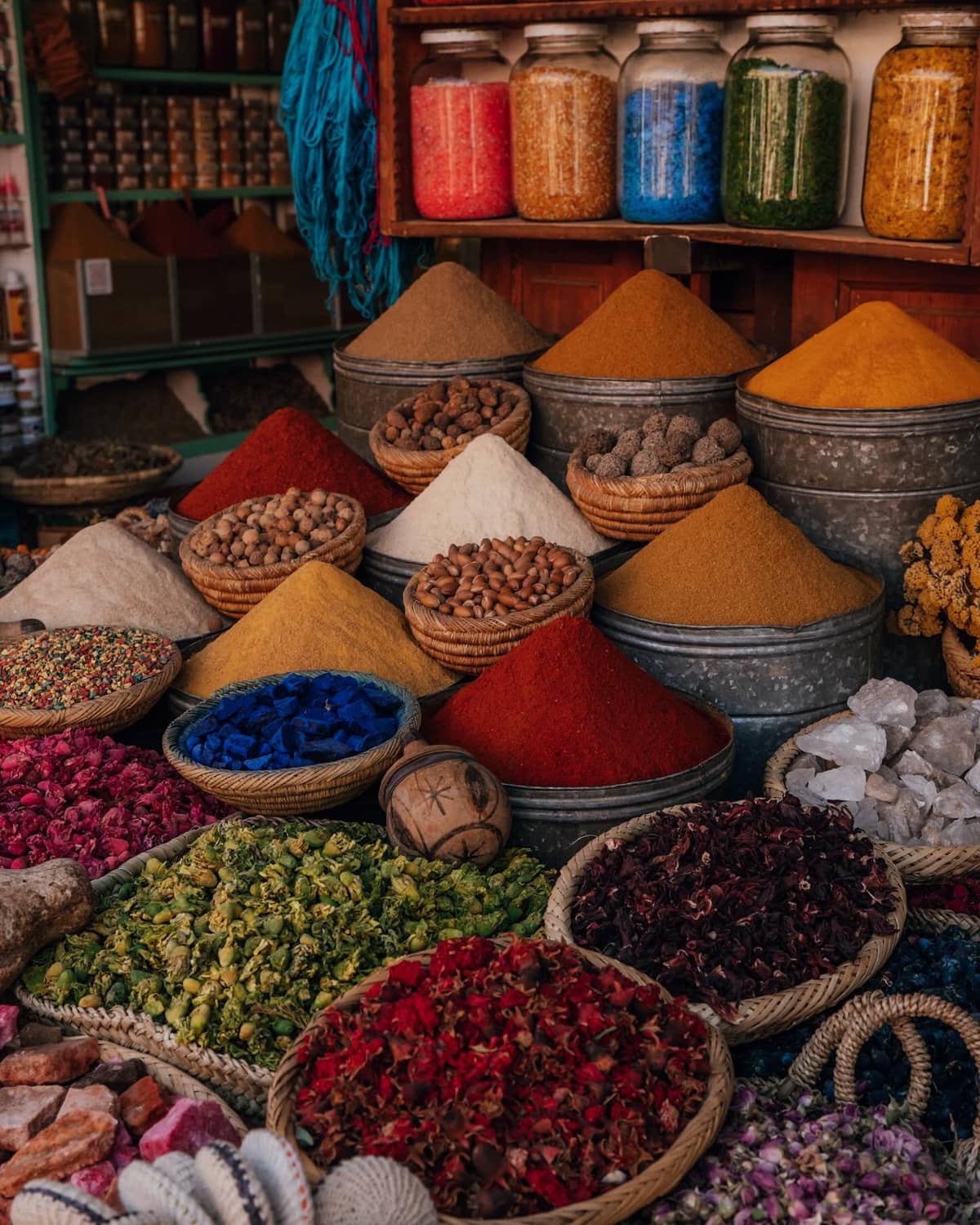 Marrakech souk with traditional Moroccan shops and colorful markets during Fes to Marrakech Desert Tour